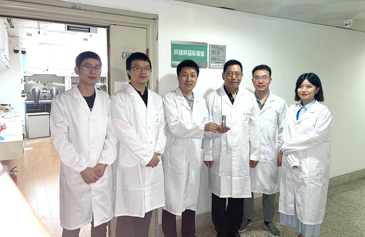 The team at Nanjing University is holding the lunar soil sample. CREDIT Yingfang Yao